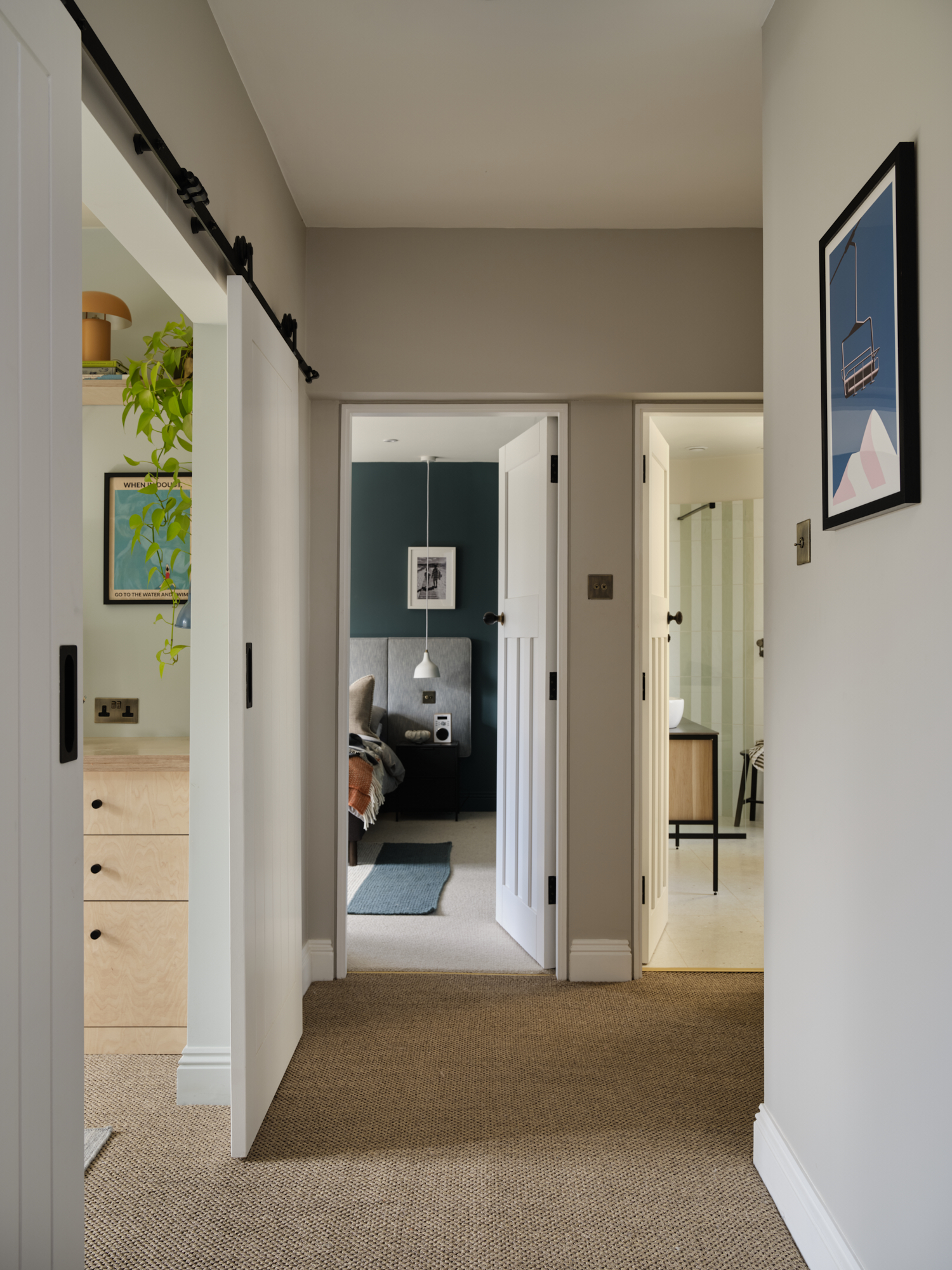 First floor hallway with barn doors open to study, bedroom and bathroom views, Victorian terrace interior design St Margarets London